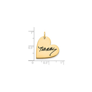 Yellow gold signature heart pendant measured against a ruler at about three quarters of an inch