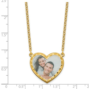 Gold plated heart photo pendant measured against a ruler at about one inch wide