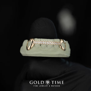 Gold heart cut out canine grillz with diamond accents on a mold, branded 'Gold Time'.