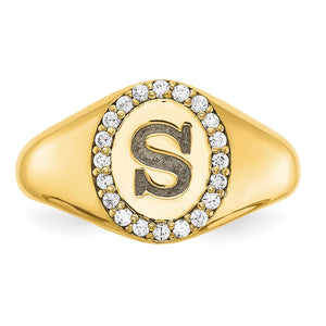 Angled close-up of the yellow gold signet ring with a textured letter S and round diamond halo