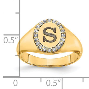 Yellow gold diamond initial signet ring beside a ruler showing the oval top is about half an inch