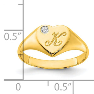Yellow gold heart initial signet ring beside a ruler showing the heart face is about half an inch wide