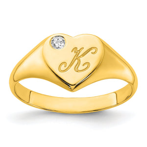Yellow gold heart signet ring with a script K initial and diamond accent, three quarter view