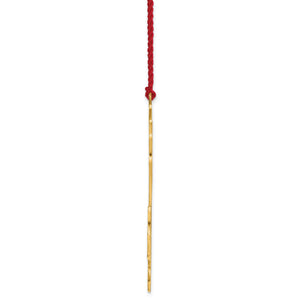 Side profile of the snowflake ornament hanging from its red cord
