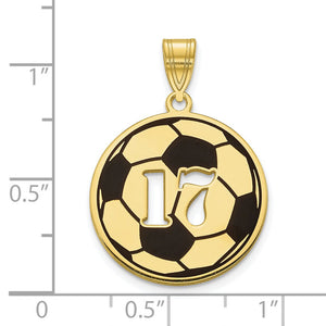Gold soccer number pendant beside a ruler showing it measures under one inch across