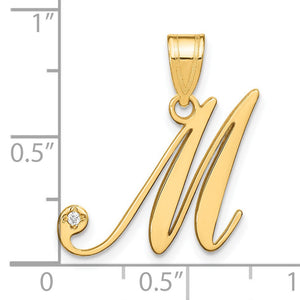 14k gold script M initial pendant with diamond next to a ruler showing it is about 1 inch tall with bail