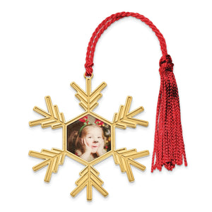 Gold plated snowflake photo ornament with a red cord and tassel