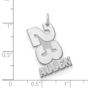 Stacked number and name charm beside a ruler, measuring about 1 inch tall