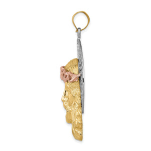 Side view of the tri-color Jesus pendant showing its depth