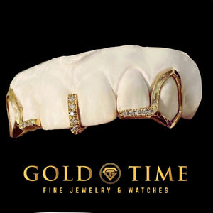 Gold 5 piece grillz on a dental model showing open face canine fangs, moissanite tips on the lateral incisors and a gap bar, Gold Time