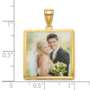 Gold plated square photo pendant beside a ruler showing it measures about one inch across