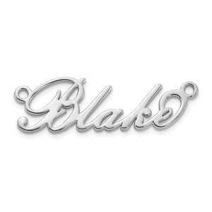 Yellow gold cursive script name necklace measured against a ruler