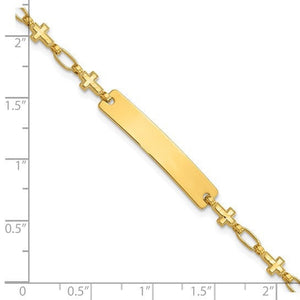 Gold plated cross link ID bracelet beside a ruler, showing the plate and link sizing