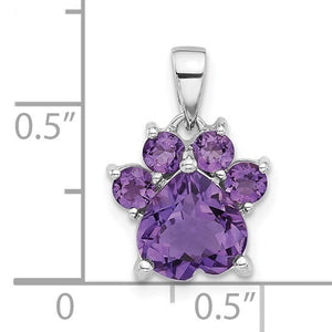 Size chart showing the amethyst paw pendant beside a ruler, about half an inch