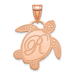 Rose gold sea turtle initial pendant with a script letter R on the shell