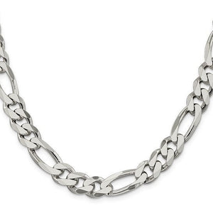 Close up of a wide sterling silver Figaro chain showing three short links and one long link