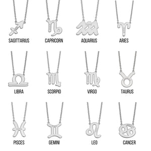 Twelve white gold zodiac pendant necklaces labeled with their sign names