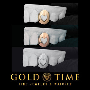 Single tooth heart cut out grillz shown in yellow gold, rose gold, and white gold on dental molds