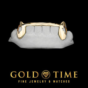 Yellow gold 6 piece grillz with Texas cut out fangs and a solid tip bar on a lower dental mold, Gold Time