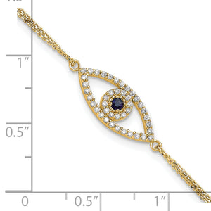 Yellow gold evil eye charm on a ruler, a little over an inch long