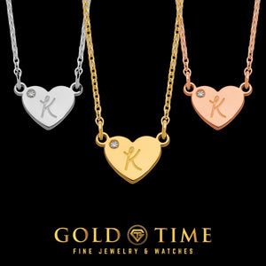 Heart initial necklaces with a diamond accent shown in white, yellow, and rose gold