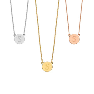 Three dainty circle initial necklaces in silver, yellow and rose shown side by side on fine chains