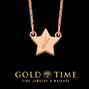 Script initial star pendant close-up detail