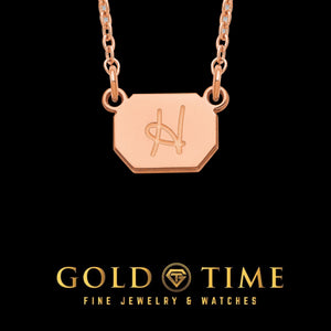 Rose gold octagonal initial charm necklace with an engraved script letter on a cable chain