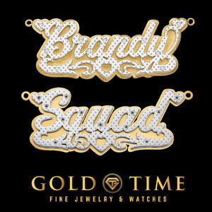 Close-up of 3D two-tone name plates reading Brandy and Squad with diamond borders and hearts