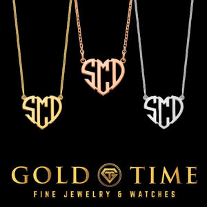 Yellow gold three initial block monogram pendant cut into a heart outline, on a fine chain
