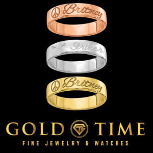 Custom engraved name rings in rose gold, silver and yellow gold stacked on a black background