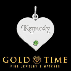 Sterling silver heart pendant engraved Kennedy with a green birthstone on a black background
