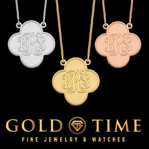 Three clover monogram pendants in silver, yellow gold and rose gold, each engraved with a three letter script monogram