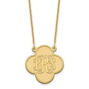 Yellow gold clover shaped pendant engraved with a three letter script monogram, on a fine chain