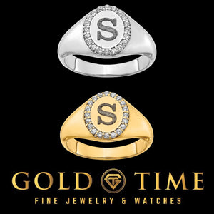 White gold and yellow gold oval signet rings engraved with the initial S inside a diamond halo, black background with the Gold Time logo