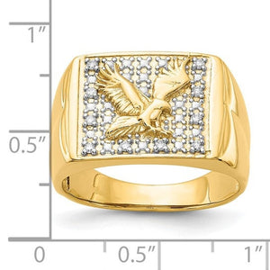 Gold eagle diamond ring next to a ruler for scale