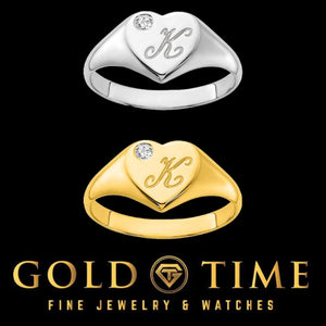 Yellow and white gold diamond heart initial signet rings engraved with a script K, on a black background with Gold Time branding
