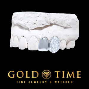 White metal double cap grill with a solid polished lateral cap and an iced honeycomb moissanite canine cap on a dental mold, Gold Time