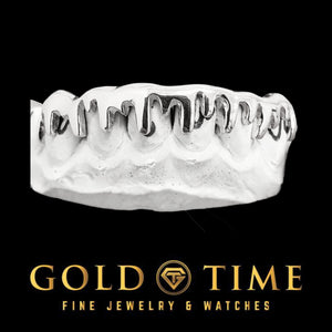 Custom silver 8 piece melting drip grillz on a mold