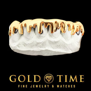 Custom yellow gold 8 piece melting drip grillz on a mold