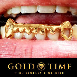 Custom 6 piece yellow gold drip grillz with open heart cut-out fangs, worn on top teeth