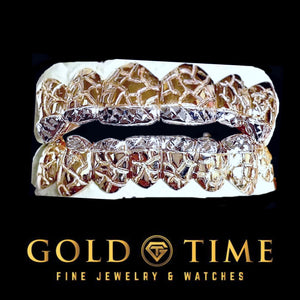 Two tone 12 piece top and bottom grillz with nugget texture and white trillion diamond-cut tips on a dental mold
