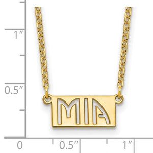 Gold plated Mia bar name pendant next to a ruler showing it is about 1 inch wide