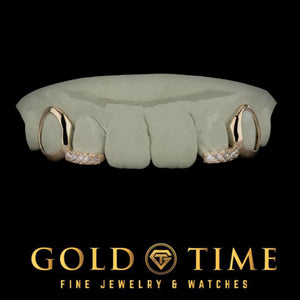 Silver 4 piece grillz with open face canines and moissanite tipped incisors on a dental mold