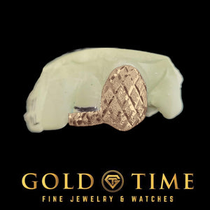 Rose tone double cap grillz with diamond cuts and dust finish on a black background with Gold Time Fine Jewelry and Watches logo