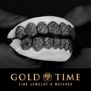 Angled view of the black perm cut grillz showing the faceted trillion diamond-cut and dust finish