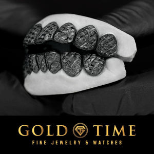 Close up of the black perm cut grillz with trillion cut faceting on the top and bottom teeth