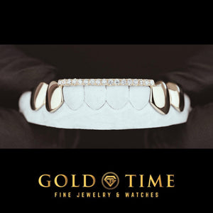 8 piece silver grill with polished solid canines and bicuspids and a moissanite tip bar across the front teeth