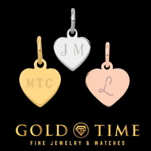 Three engraved heart charms in yellow, white and rose gold with the initials MTC, JM and L on a black Gold Time card