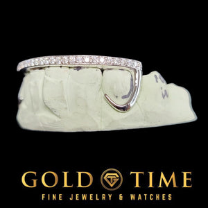 Angled view of white gold hooks grillz showing the canine hook and moissanite row
